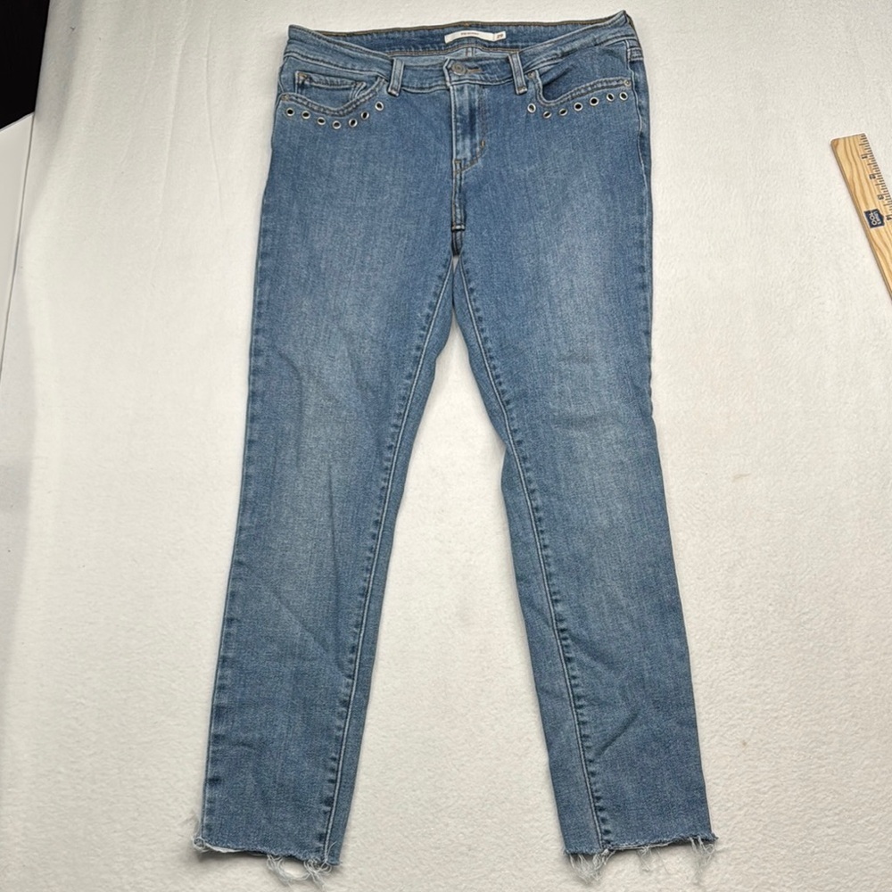 Levi's 711 skinny Blue Ankle Cropped Jeans with Raw Hem denim with rivets eyelet